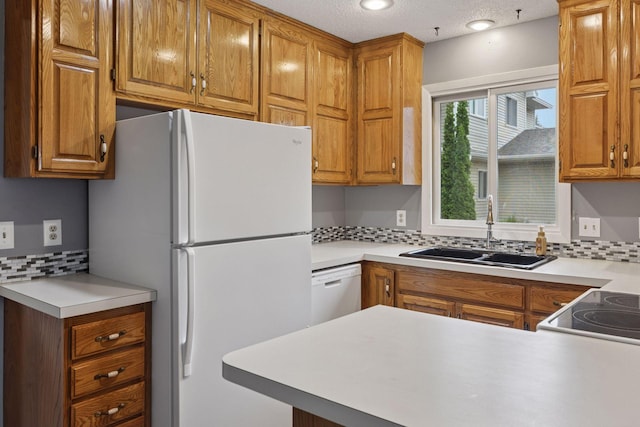 1513 Creek Meadows Dr NW, Coon Rapids, MN 55433 - kitchen with white appliances, backsplash, light countertops, and brown cabinets