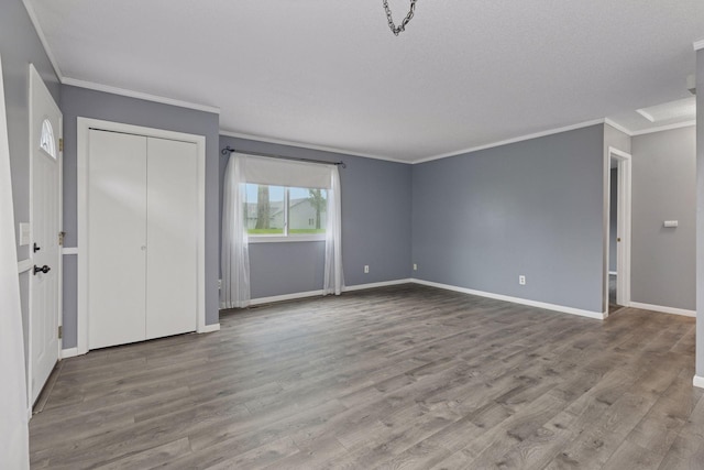 1513 Creek Meadows Dr NW, Coon Rapids, MN 55433 - unfurnished bedroom featuring ornamental molding, wood finished floors, and a closet