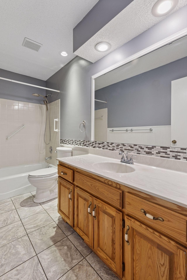 1513 Creek Meadows Dr NW, Coon Rapids, MN 55433 - bathroom with bathing tub / shower combination, vanity, a textured ceiling, backsplash, and tile patterned flooring