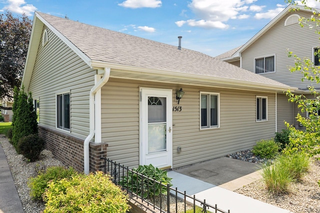 1513 Creek Meadows Dr NW, Coon Rapids, MN 55433 - view of front of house featuring a shingled roof and brick siding