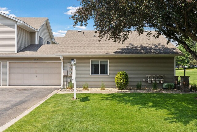 1513 Creek Meadows Dr NW, Coon Rapids, MN 55433 - view of front of property with an attached garage, driveway, a front lawn, and a shingled roof