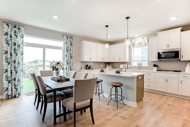 528 Goldenrod Trl, Waconia, MN 55387 - dining space with light wood-style flooring and recessed lighting