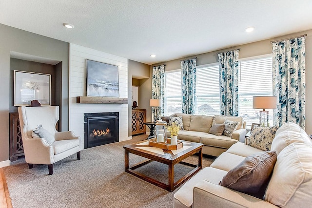 528 Goldenrod Trl, Waconia, MN 55387 - carpeted living area with healthy amount of natural light, a large fireplace, recessed lighting, and built in features