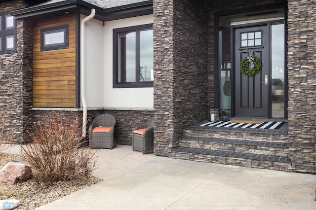 entrance to property with stucco siding and stone siding