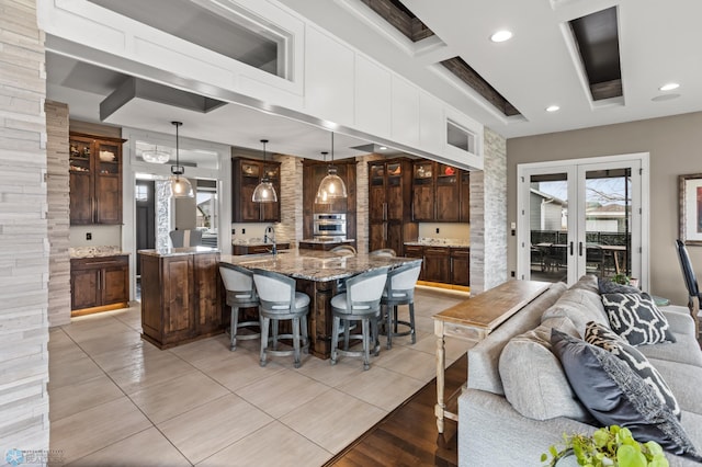 dining room with french doors, light tile patterned floors, recessed lighting, coffered ceiling, and beam ceiling