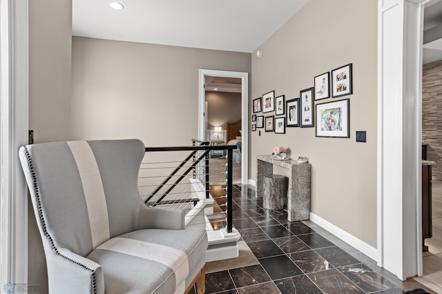 sitting room with baseboards, marble finish flooring, and recessed lighting