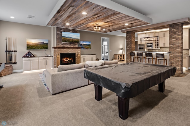 recreation room featuring light carpet, a fireplace, ornate columns, recessed lighting, and billiards