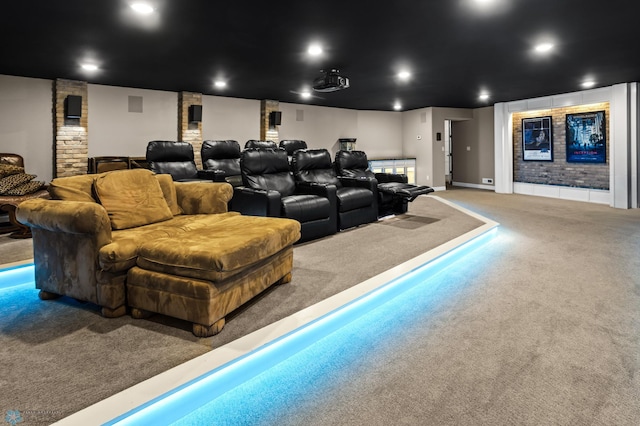 carpeted home theater room featuring baseboards
