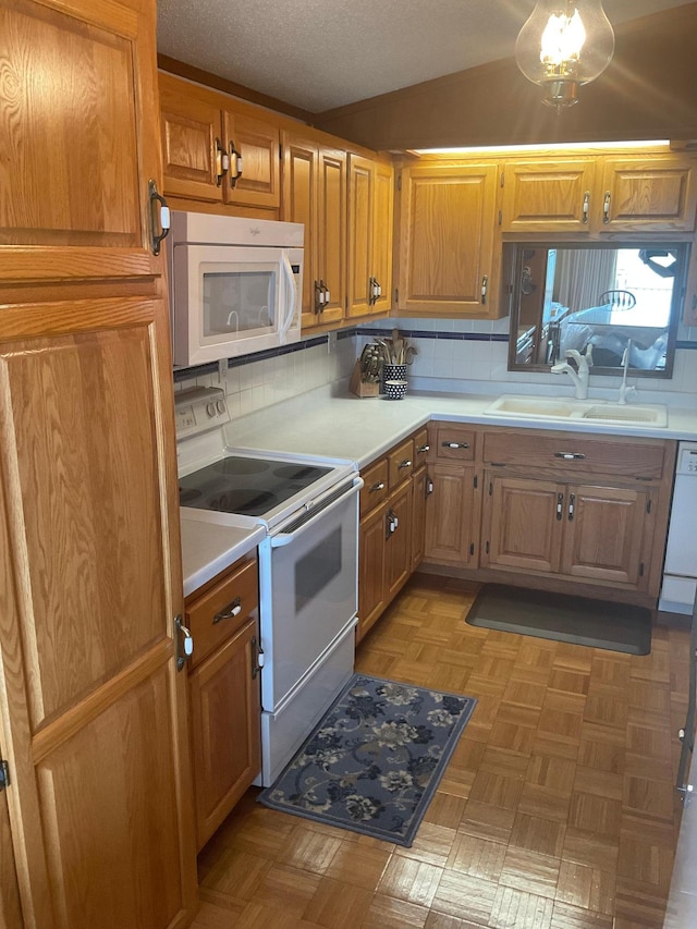 36074 County Highway 72, Everts Twp, MN 56515 - kitchen featuring a sink, light countertops, vaulted ceiling, and white appliances