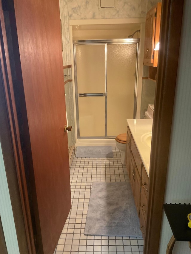 36074 County Highway 72, Everts Twp, MN 56515 - full bath with vanity, tile patterned floors, a shower stall, and toilet