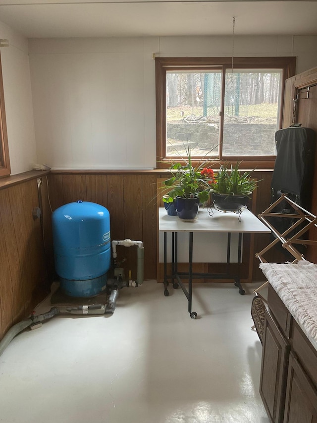 36074 County Highway 72, Everts Twp, MN 56515 - interior space featuring concrete flooring, wood walls, and plenty of natural light