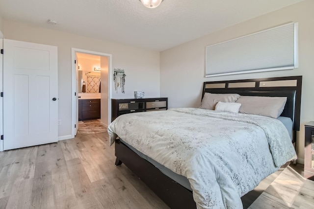 bedroom featuring light wood-style floors
