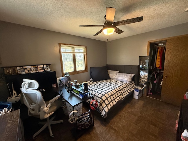 bedroom with a textured ceiling and a ceiling fan