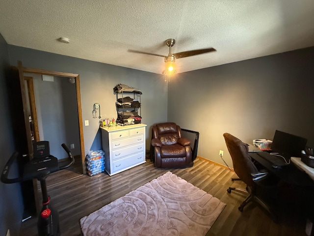 office area with ceiling fan, wood finished floors, and a textured ceiling