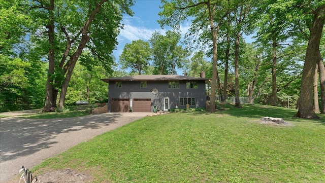 19593 Minnesota Highway 22, Greenleaf Twp, MN 55355 - view of front facade featuring driveway, a garage, a front yard, and a chimney