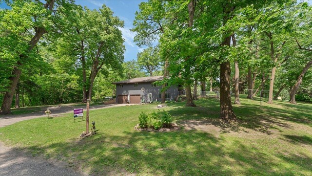 19593 Minnesota Highway 22, Greenleaf Twp, MN 55355 - view of green lawn featuring driveway and an attached garage