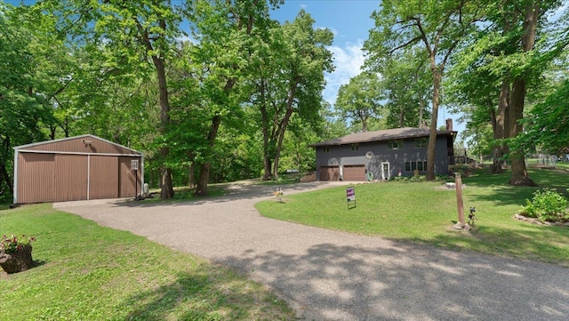 19593 Minnesota Highway 22, Greenleaf Twp, MN 55355 - view of grassy yard with driveway, a pole building, an attached garage, and an outbuilding