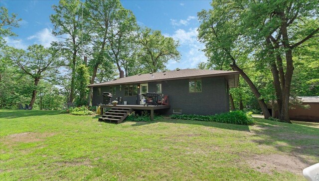 19593 Minnesota Highway 22, Greenleaf Twp, MN 55355 - rear view of property with a deck, a yard, and a chimney