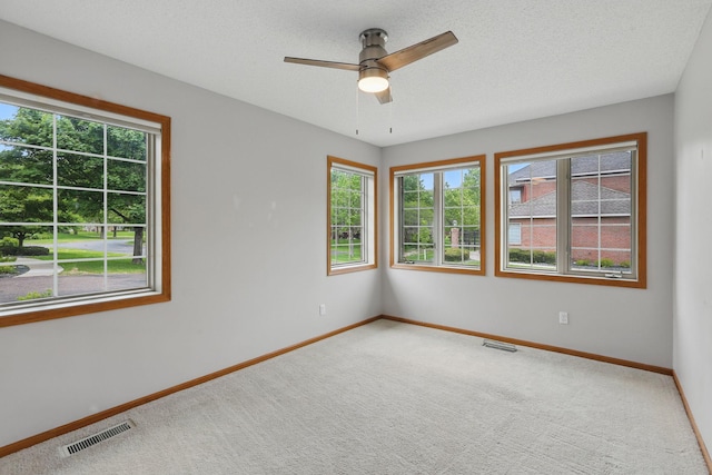 13409 44th Cir NE, Saint Michael, MN 55376 - unfurnished room with carpet flooring, baseboards, a ceiling fan, and a textured ceiling