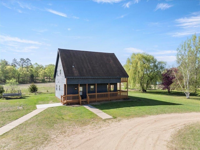 view of front of property featuring covered porch and a front yard
