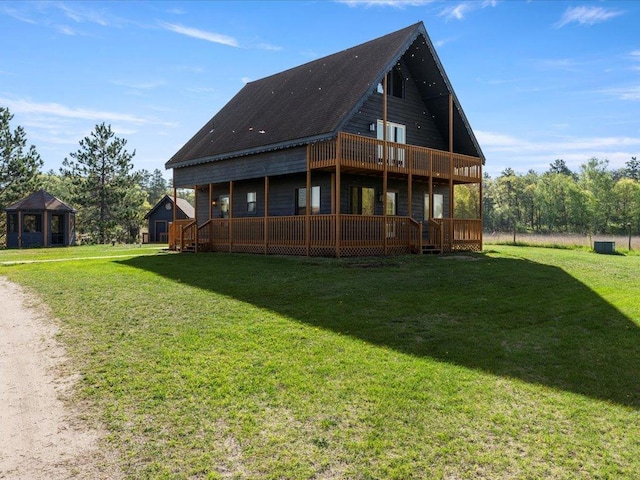 back of property featuring a yard and a deck