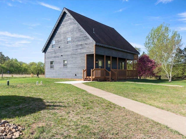 view of front of house with a porch and a front lawn