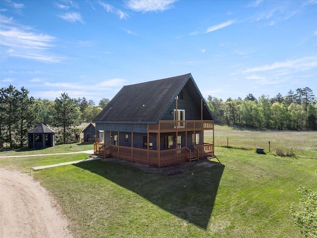 14122 13th Ave SW, Sylvan Twp, MN 56473 - rear view of house with a lawn, a wooden deck, and dirt driveway