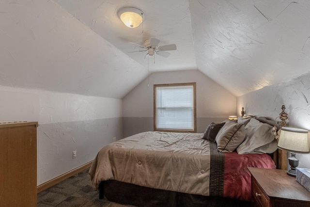 bedroom with lofted ceiling, a ceiling fan, and carpet flooring