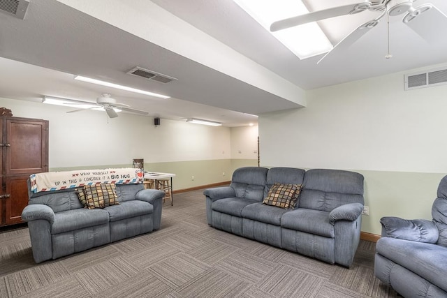 living room featuring light carpet, visible vents, and ceiling fan