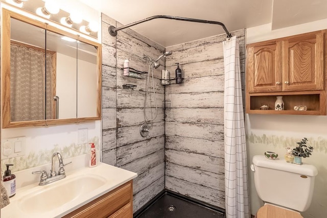 bathroom with toilet, vanity, and curtained shower