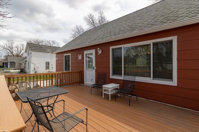 wooden deck with outdoor dining area