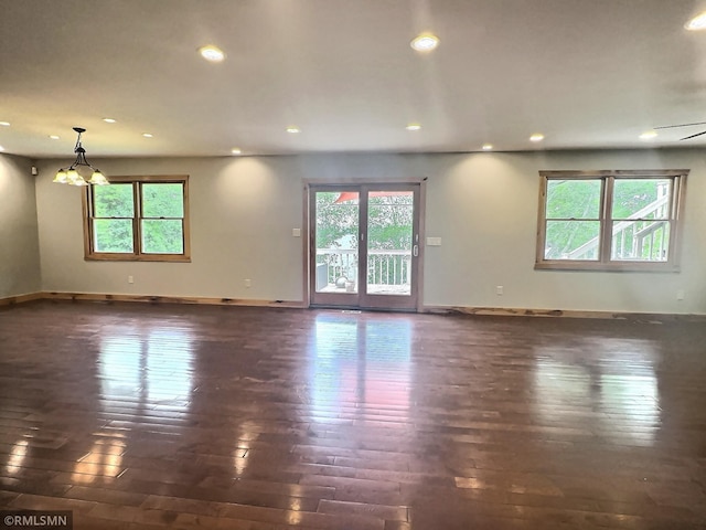 7861 Greer Ave NW, Maple Lake, MN 55358 - spare room with plenty of natural light, dark wood finished floors, recessed lighting, and baseboards