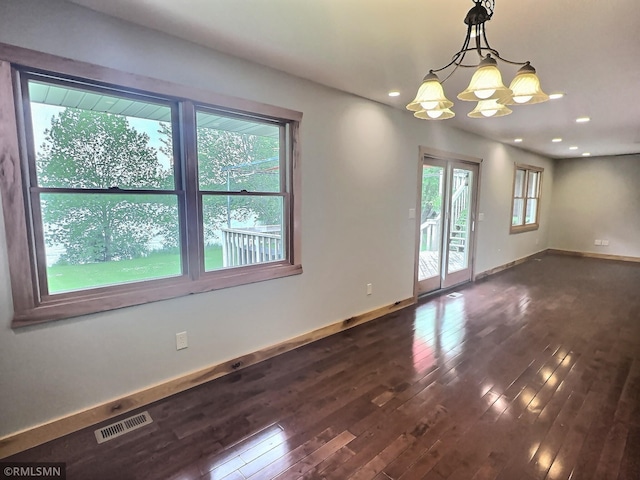 7861 Greer Ave NW, Maple Lake, MN 55358 - empty room with dark wood-style floors, a chandelier, baseboards, and recessed lighting