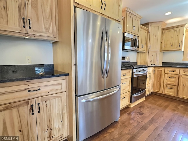 7861 Greer Ave NW, Maple Lake, MN 55358 - kitchen with appliances with stainless steel finishes, light brown cabinets, dark wood-style flooring, recessed lighting, and dark stone counters