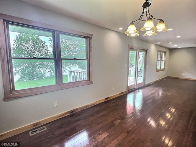 7861 Greer Ave NW, Maple Lake, MN 55358 - unfurnished room with dark wood-style flooring, a chandelier, and recessed lighting