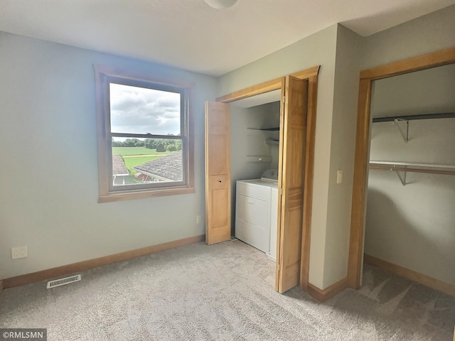 7861 Greer Ave NW, Maple Lake, MN 55358 - laundry area featuring washer / dryer and light carpet