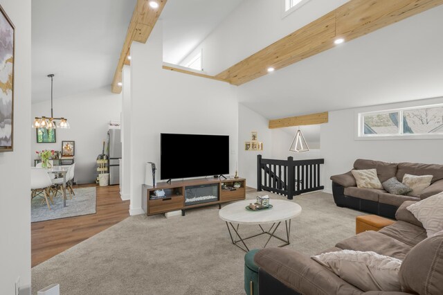 613 Cromwell Ave, Saint Paul, MN 55104 - carpeted living room with a chandelier, beamed ceiling, high vaulted ceiling, recessed lighting, and wood finished floors