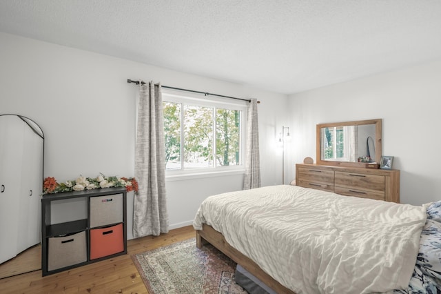 613 Cromwell Ave, Saint Paul, MN 55104 - bedroom featuring wood finished floors and baseboards