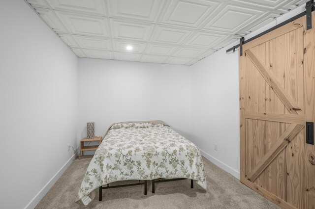 613 Cromwell Ave, Saint Paul, MN 55104 - bedroom featuring a barn door, light colored carpet, baseboards, recessed lighting, and an ornate ceiling