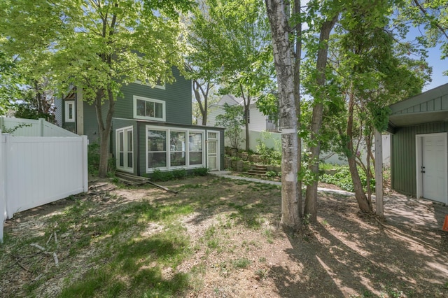 613 Cromwell Ave, Saint Paul, MN 55104 - view of yard with a sunroom and fence