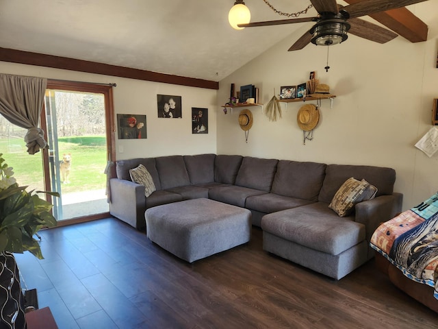 living room featuring lofted ceiling, a ceiling fan, and dark wood-style flooring