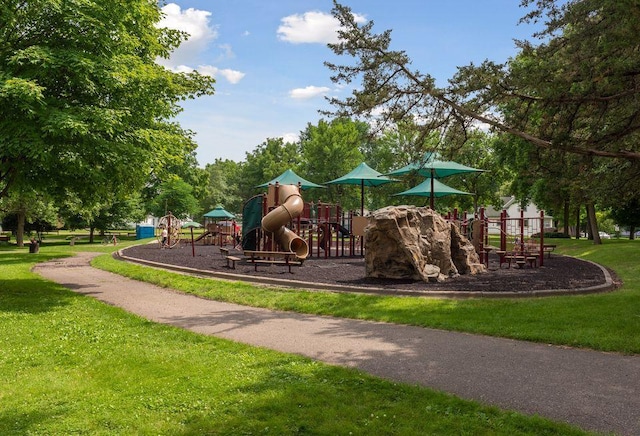 communal playground featuring a lawn