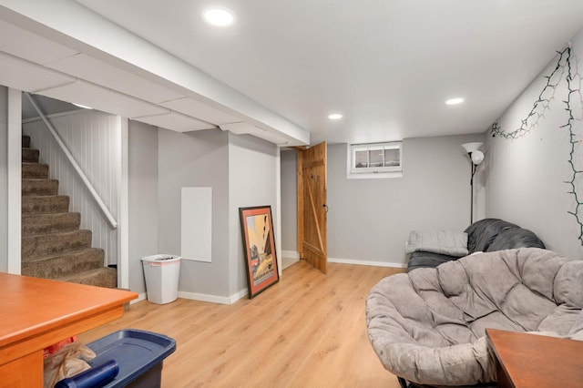 interior space featuring baseboards, stairs, and light wood-style flooring