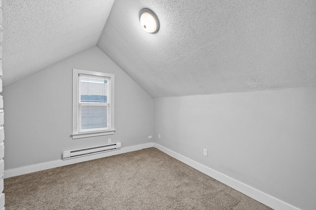 3806 Jackson St NE, Columbia Heights, MN 55421 - bonus room featuring a baseboard radiator, a textured ceiling, vaulted ceiling, carpet floors, and baseboards