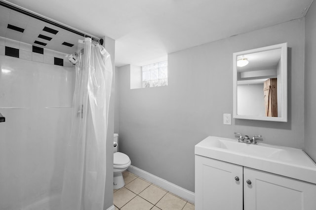 3806 Jackson St NE, Columbia Heights, MN 55421 - bathroom with tile patterned floors, toilet, vanity, curtained shower, and baseboards