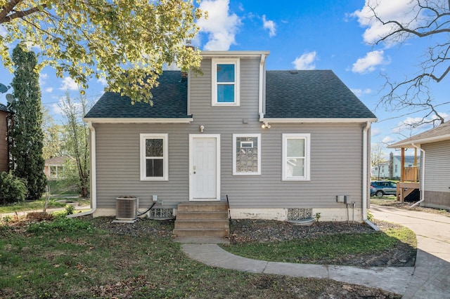 3806 Jackson St NE, Columbia Heights, MN 55421 - rear view of house with entry steps, roof with shingles, and central air condition unit