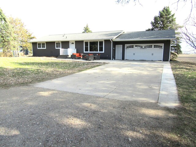 110 90th St SE, Maynard, MN 56241 - ranch-style home with concrete driveway, a front yard, and a garage