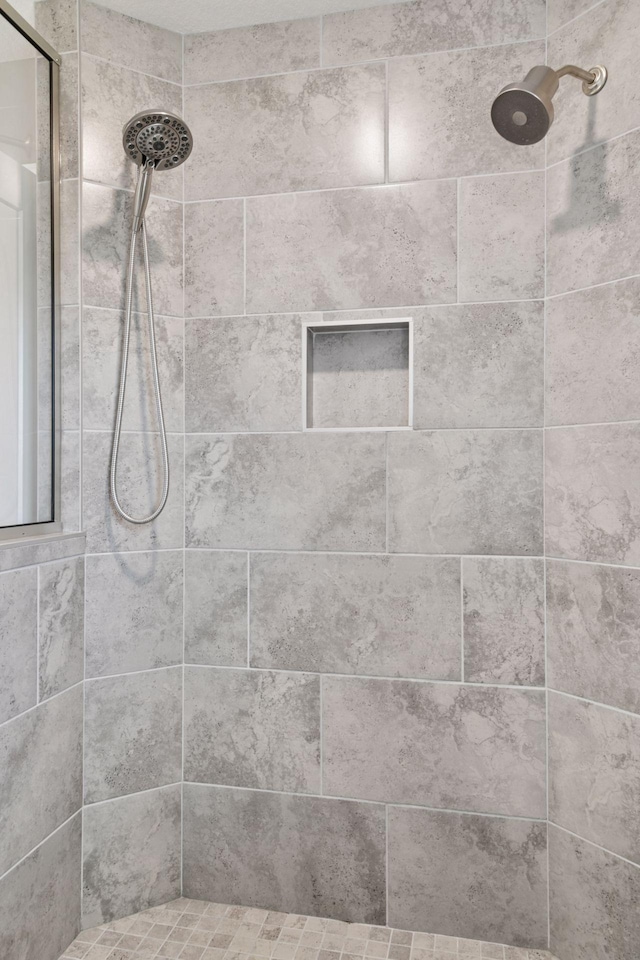 bathroom view of tiled shower