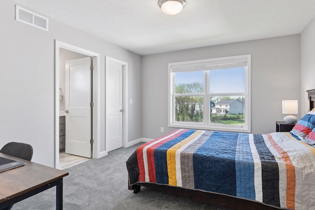 carpeted bedroom with baseboards