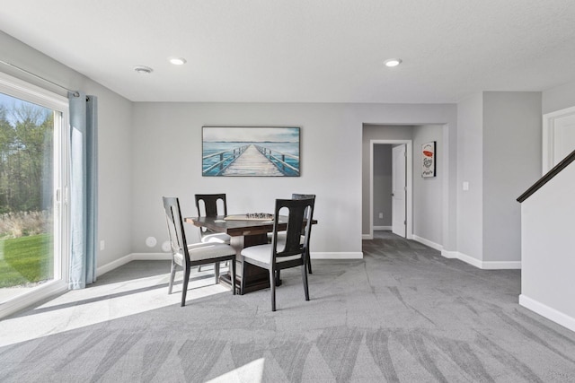 dining space with carpet, baseboards, and recessed lighting